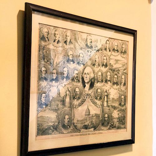 The image shows a framed print with portraits of various historical figures, predominantly featuring one central larger portrait, likely depicting U.S. presidents.